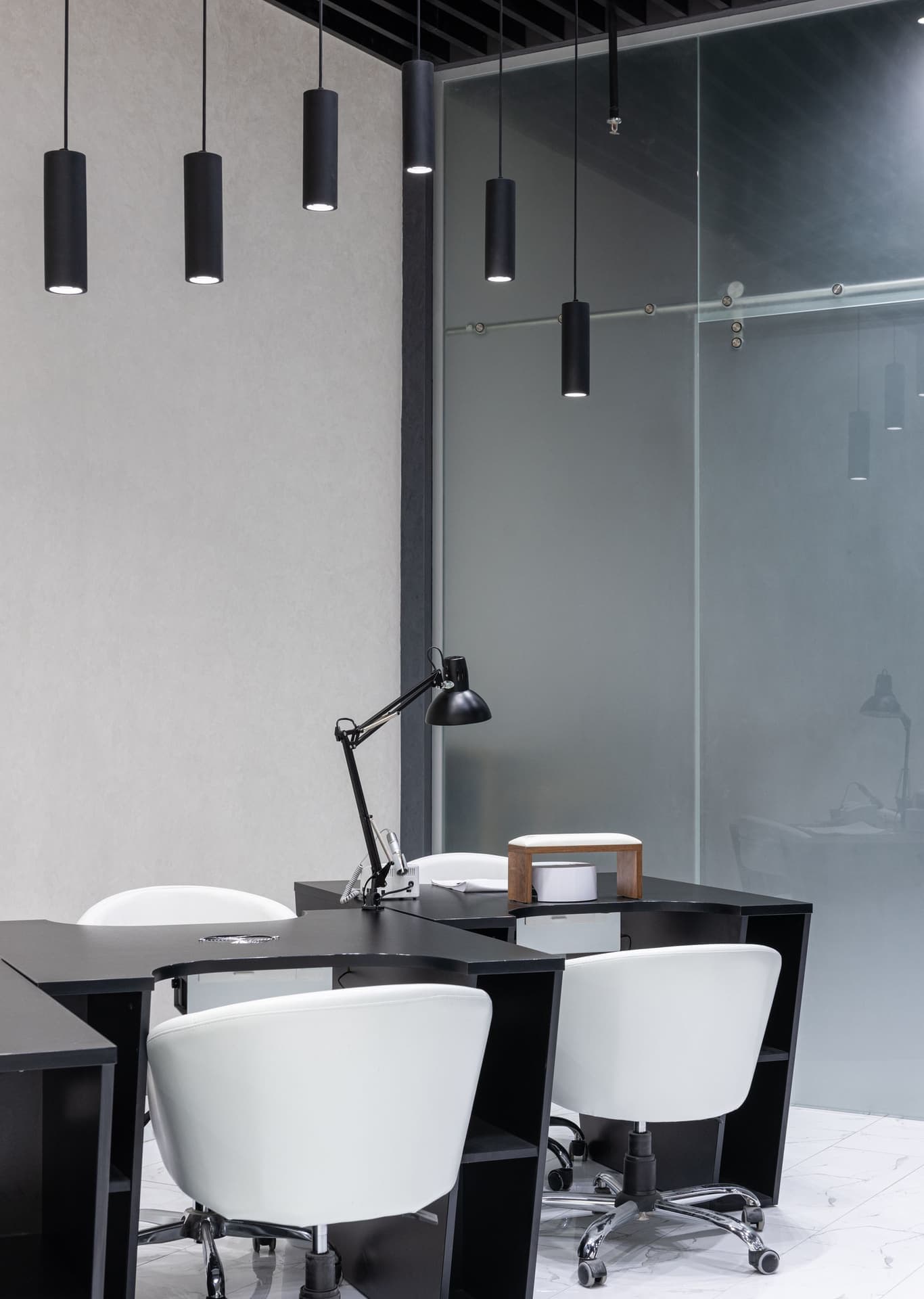 Black furniture under pendant lights